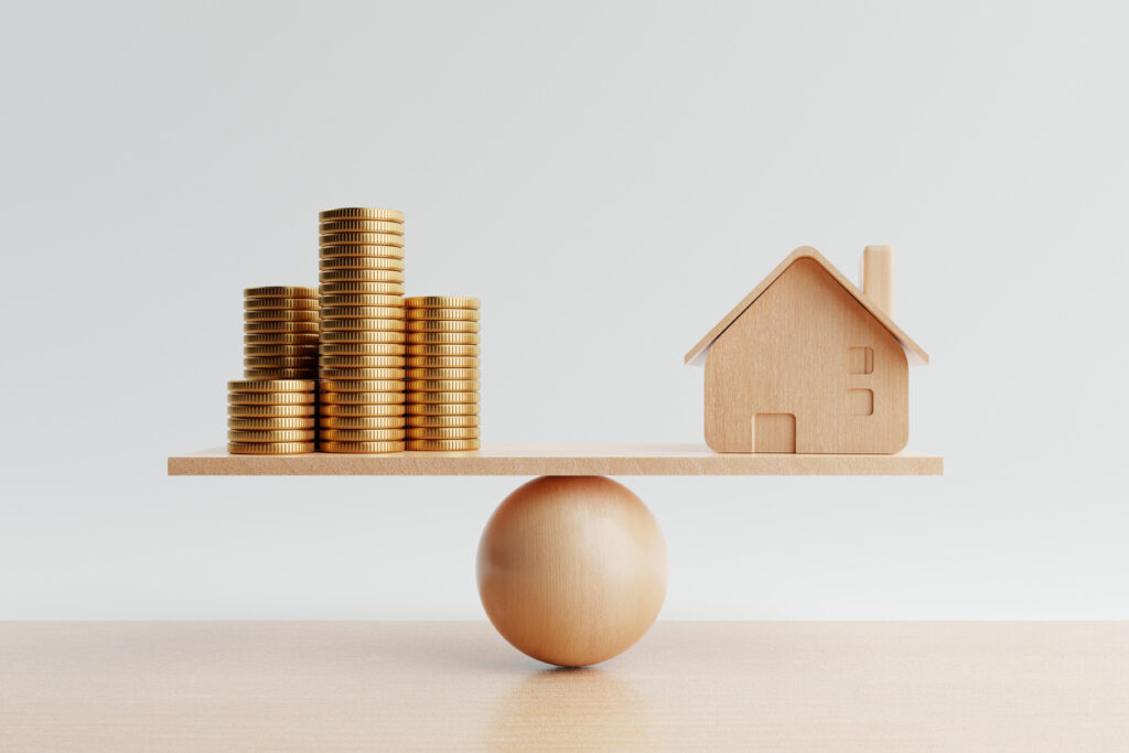 Wooden house and golden coin on balancing scale on white background Real estate business mortgage investment and financial loan concept Money-saving and cashflow theme 3D illustration rendering - 住宅AIコンシェルジュ
